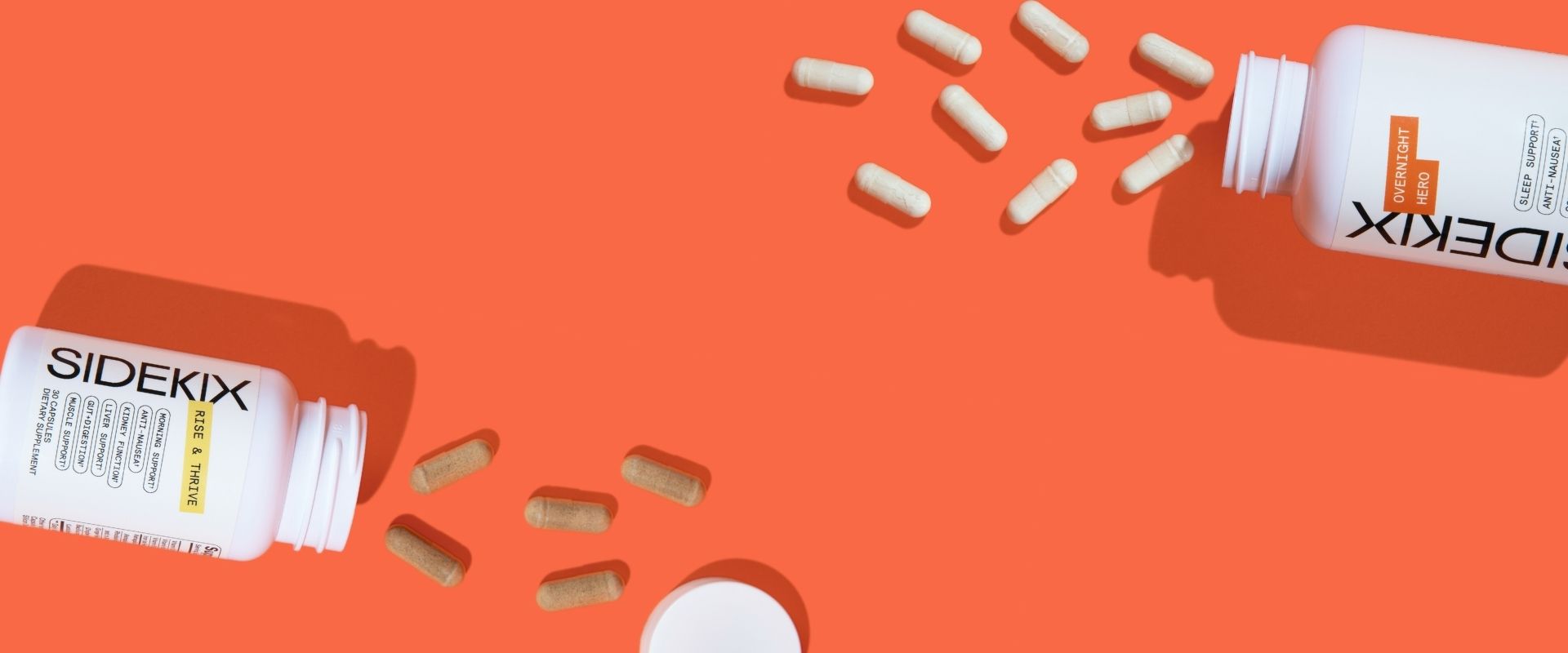 Sidekix Dietary Supplement bottles (Overnight Hero and Rise& Thrive products) open with capsules spread on orange background